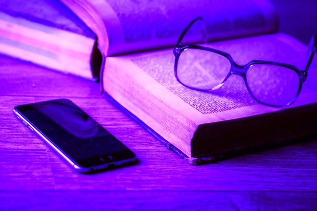 Image of book and phone
