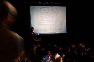 Madame Lark shows an overhead slide of Caxton's original home in Paddington