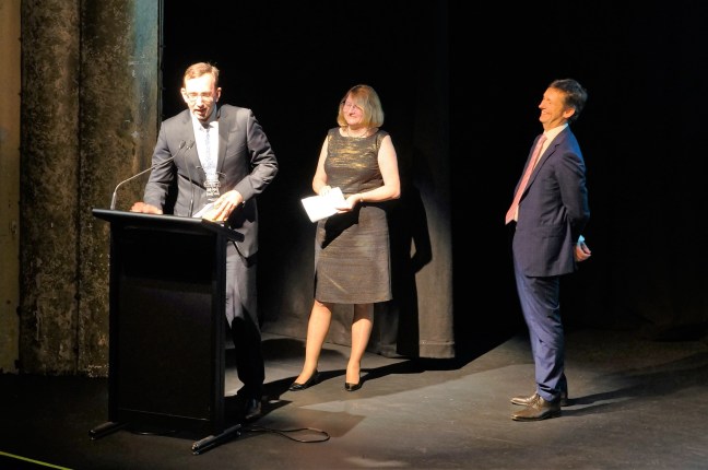 Stuart Unwin receiving his award from Chief Justice Catherine Holmes 